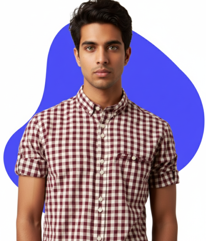 an indian man with dark hair and skin, wearing a peach athletic shirt and sports watch, poses with crossed arms and a hand on his chin against a blue and white abstract background.